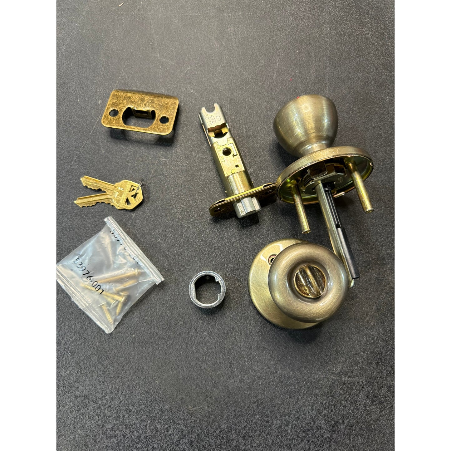 Kwikset Tylo Entry Door Knob Antique Brass Open Box