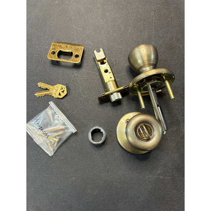 Kwikset Tylo Entry Door Knob Antique Brass Open Box
